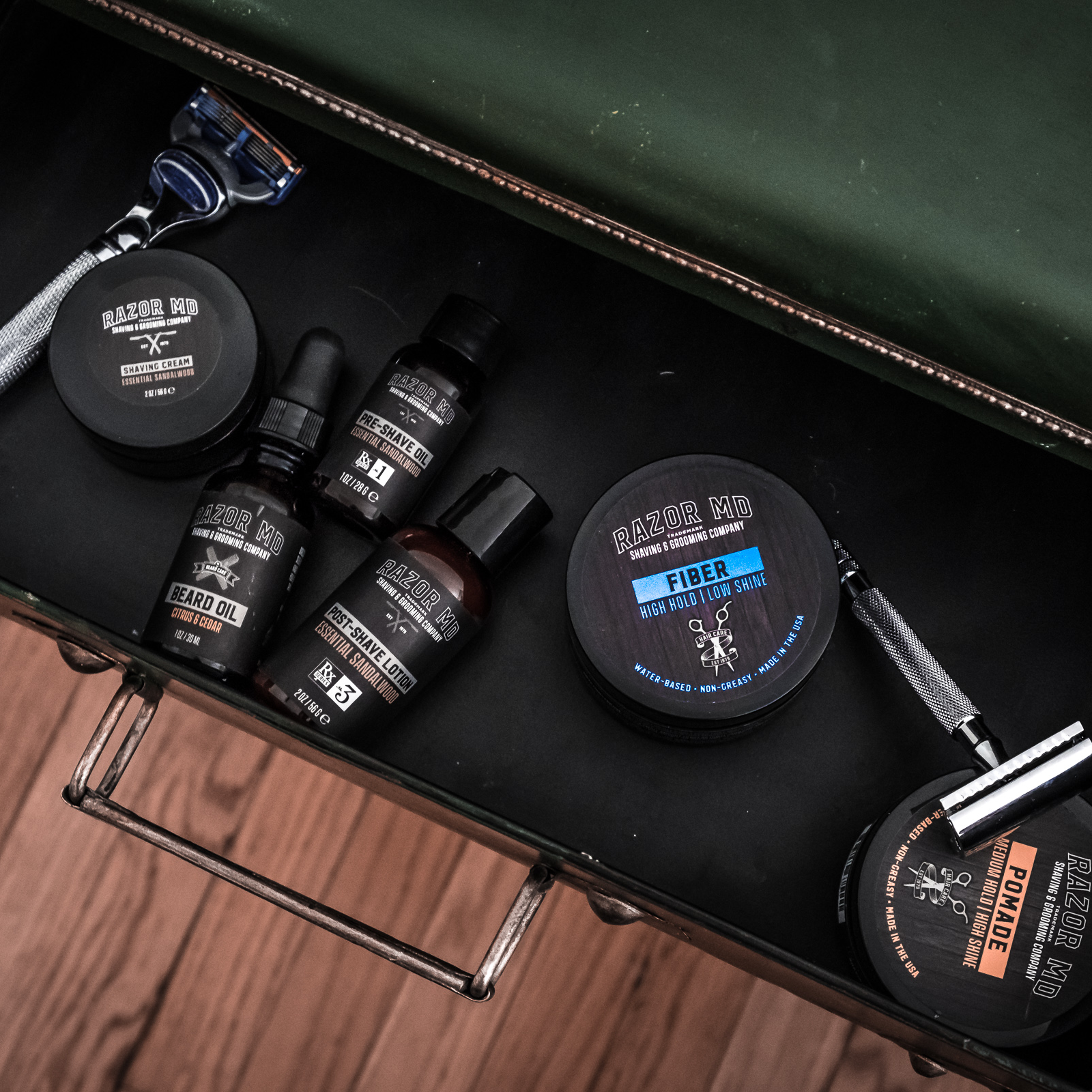 RAZOR MD Grooming products including bottles, jars, and a razor in an open drawer.