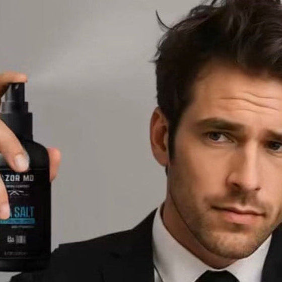 Man holding a bottle of 'RAZOR MD' Sea Salt product against a neutral background